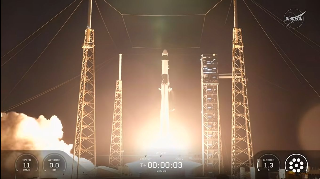 A SpaceX Falcon 9 rocket lifts off from the launch pad on a column of flame and exhaust.